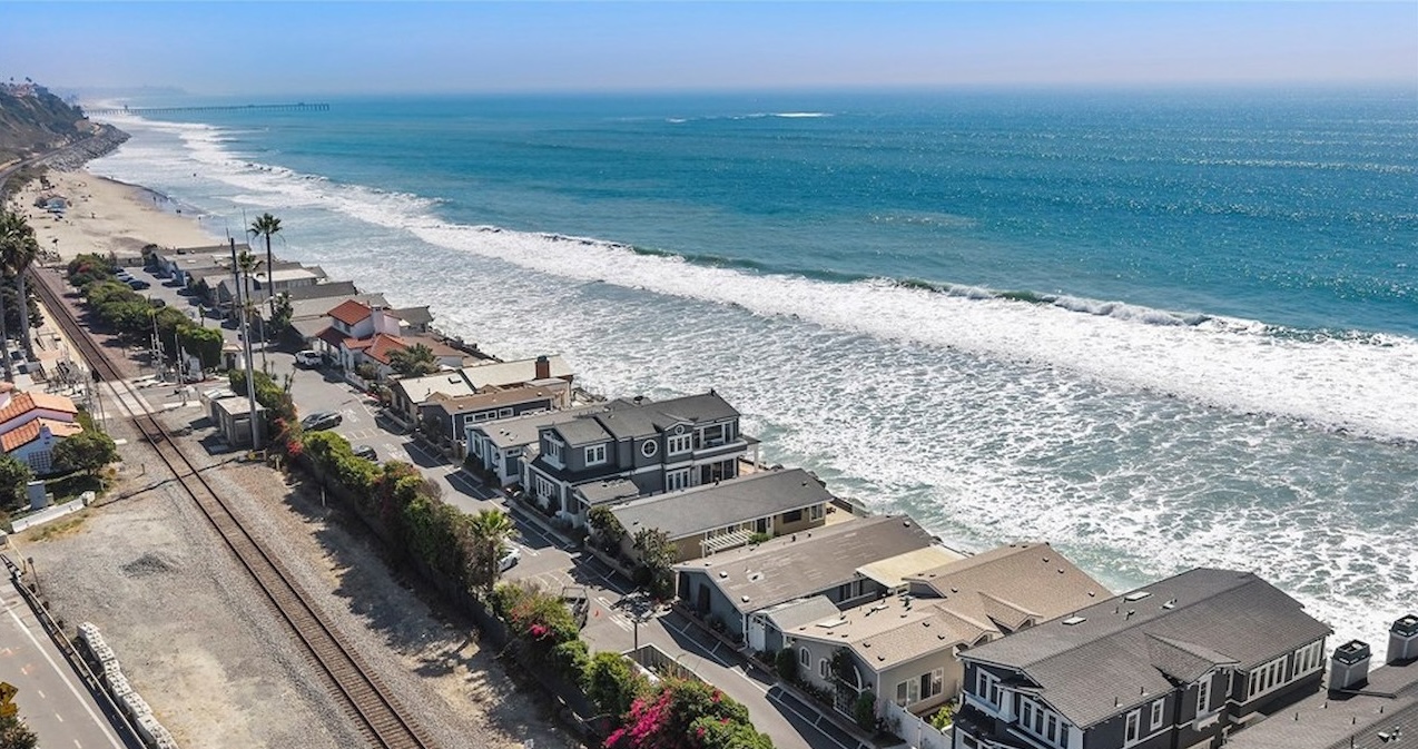 Aerial view of oceanfront single-family homes along the beach in San Clemente, California